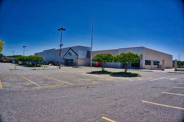 Series showing select demolition of K-Mart building in Virginia Beach, including asbestos abatement.