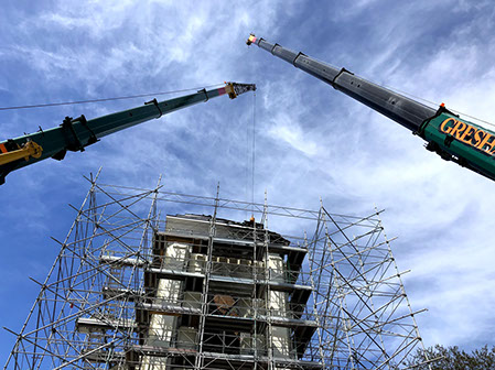 Cranes working structure for burnt materials removal and church steeple fire.