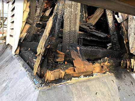 Closeup of materials damaged by fire in steeple, United Methodist Church.