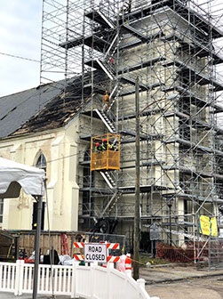 Street level view of scaffolding at church steeple fire.