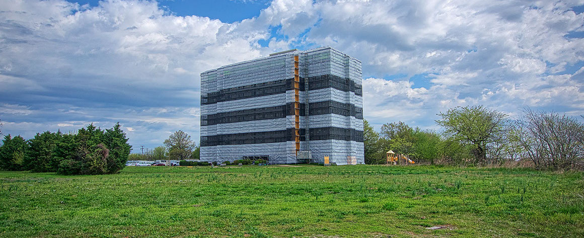 Safety wrapped Ivy Tower Building during select demolition and abatement, Hampton VA