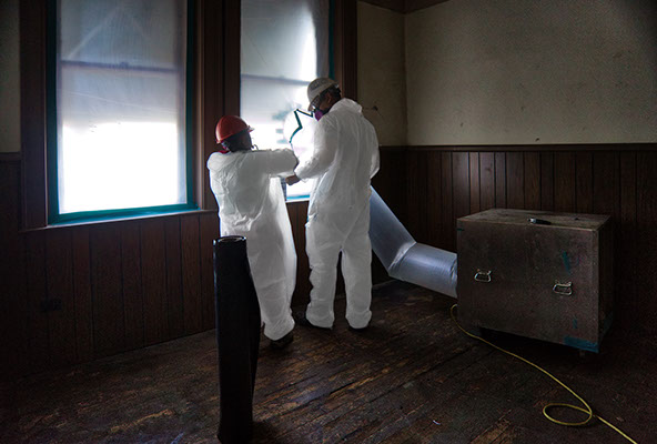 Abatement of asbestos in wall and flooring of historic Essex Building, Norfolk VA